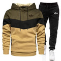 Adidas tracksuit with hoodie and pants on a white background