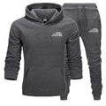 Gray hoodie and pants set with 'The Storm Sports' logo on a white background