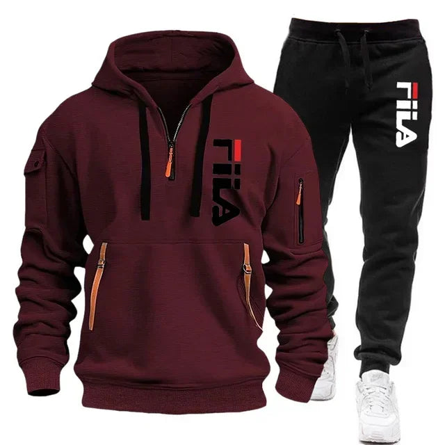 Maroon hoodie and black pants with Fila logo on a white background