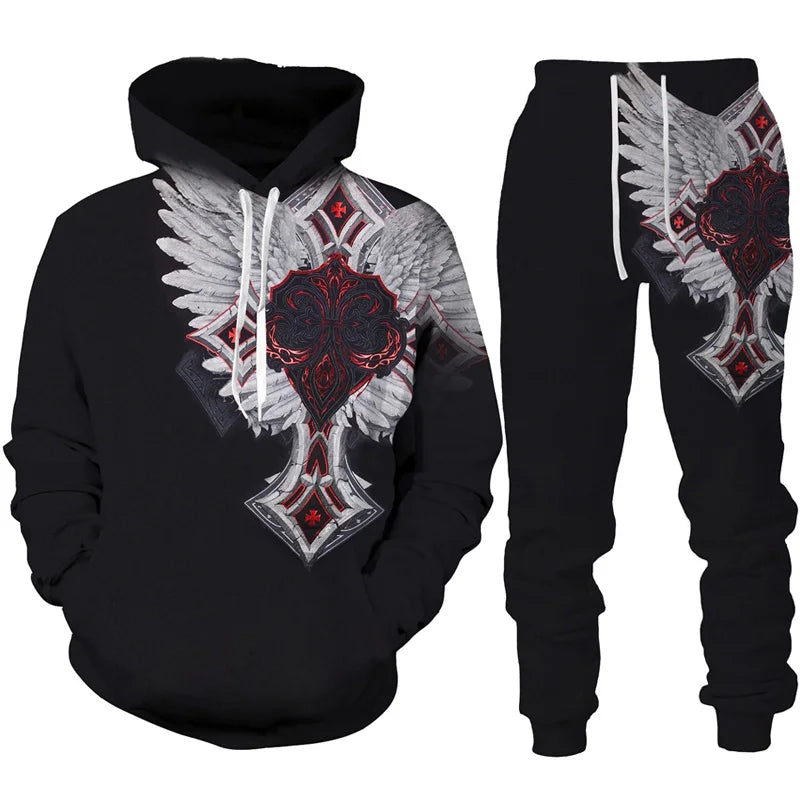 Black hoodie and pants set with winged cross design on a white background