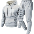 Gray hoodie and pants set with branding on a white background