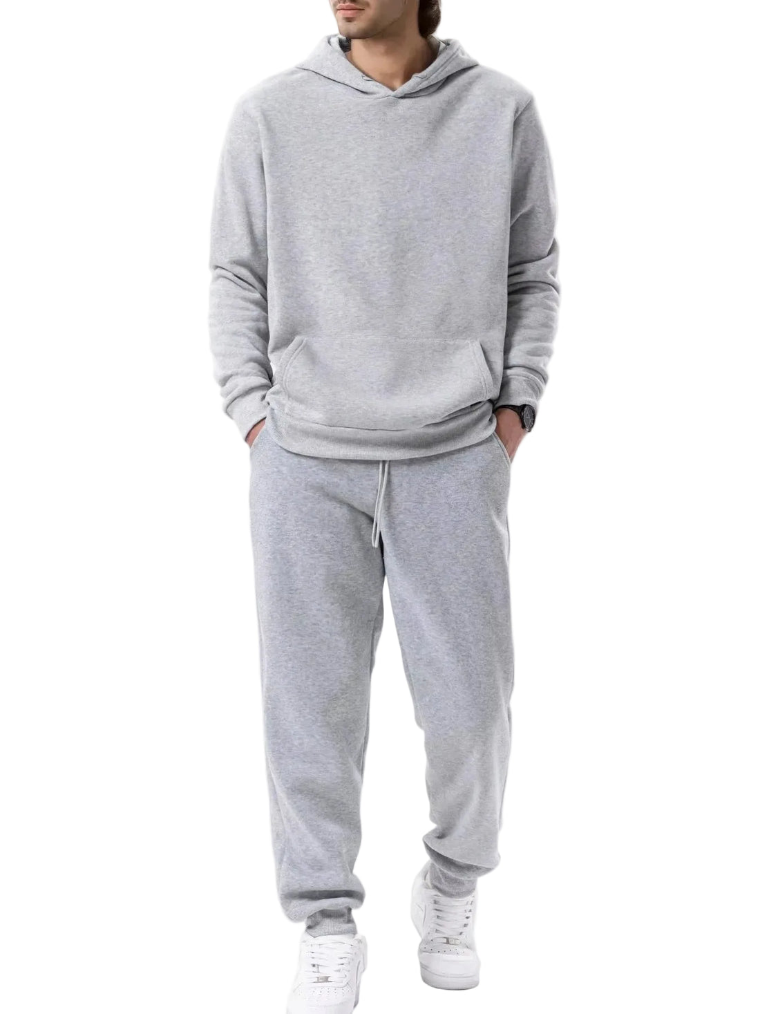 Person wearing a black tracksuit on a white background