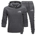 Gray hoodie and pants set with 'The Storm Sports' logo on a white background