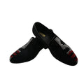 A pair of men's luxury crystal studded slip-on loafers in black with red and white accents.
