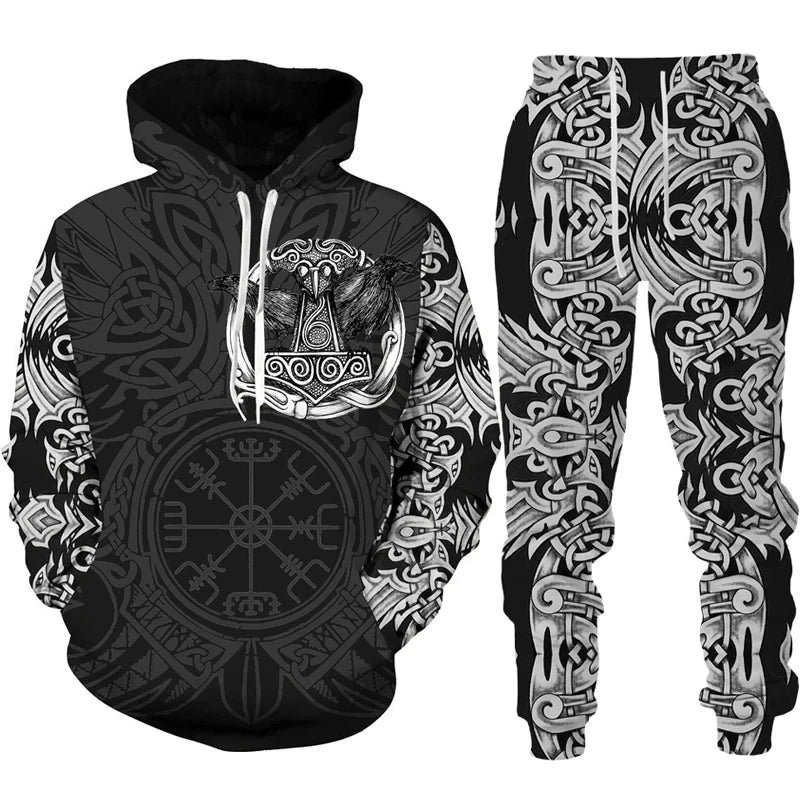 Black and white hoodie and pants set with intricate designs on a white background