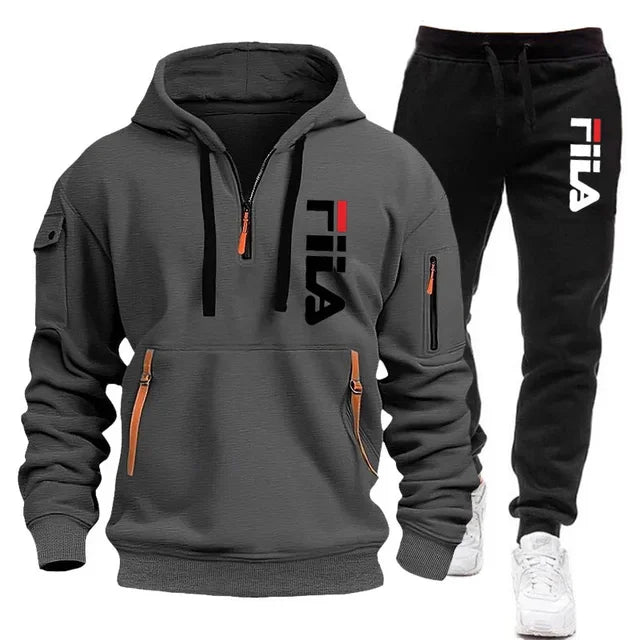 Gray hoodie and black pants with Fila logo on a white background