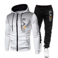 White hoodie with black zipper and black pants with white logo on a white background