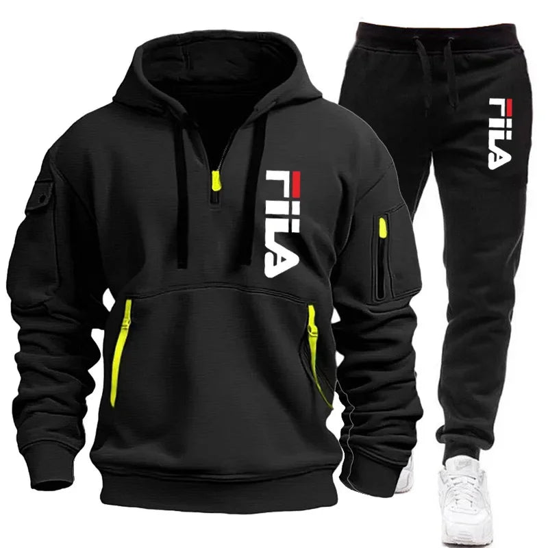 Black FILA hoodie and pants set with yellow accents on a white background