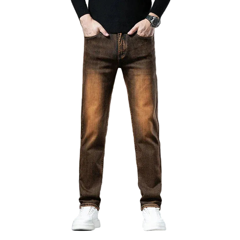 Brown jeans worn by a person on a white background