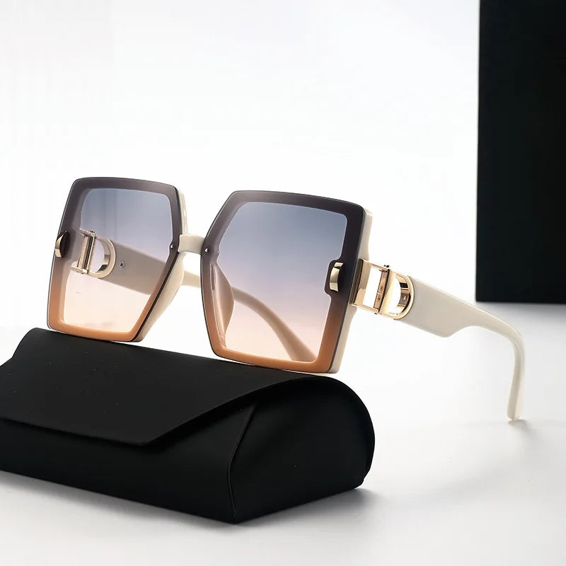 Sunglasses with gold accents on a black case against a white background