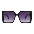 Black sunglasses with purple gradient lenses on a white background