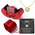 Red jewelry box with a gold necklace and heart-shaped pendant on a white background