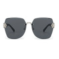 Sunglasses with floral embellishments on a white background