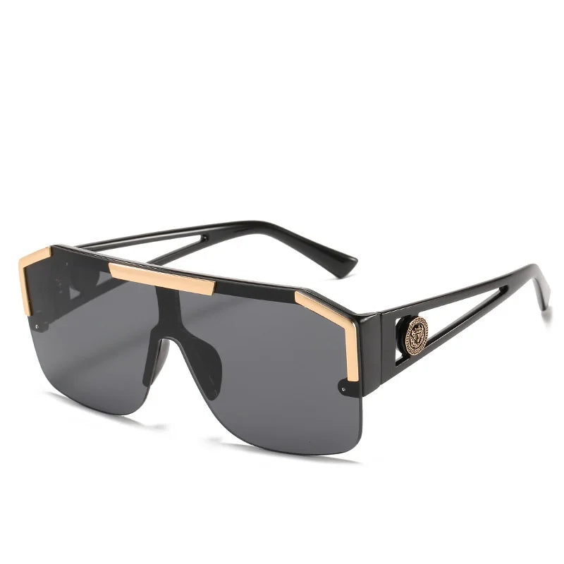 Sunglasses with black and gold frame on a white background