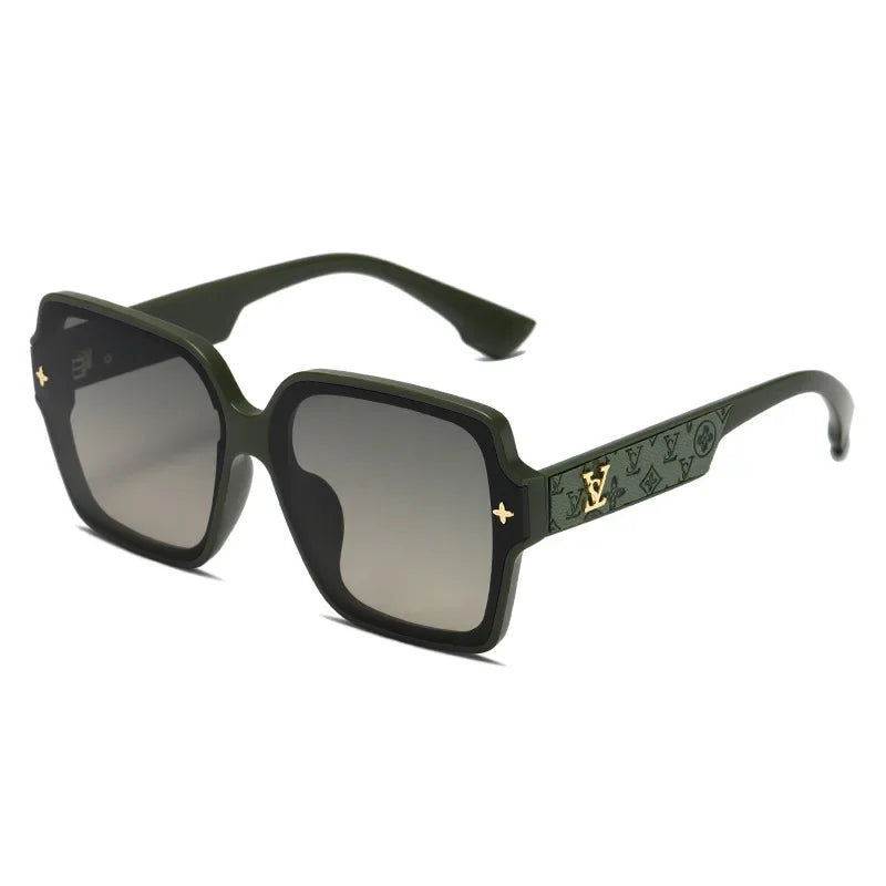 Green sunglass with a decorative golden V on the arms on a white background