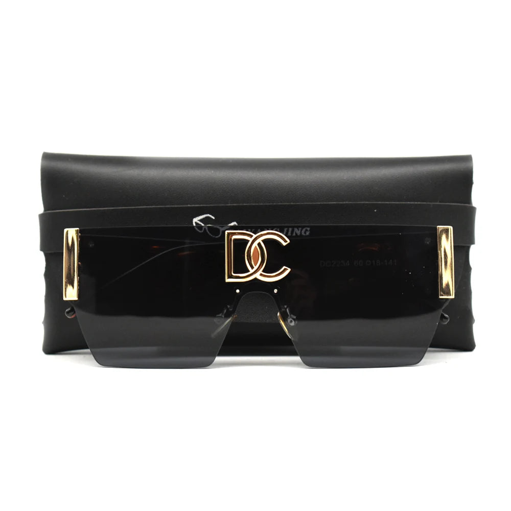 Black sunglasses with gold accents on a white background