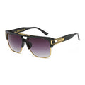 Sunglasses with black and gold frame on a white background