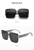 Black sunglasses with decorative arms on a white background