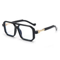 Black and gold eyeglasses on a white background