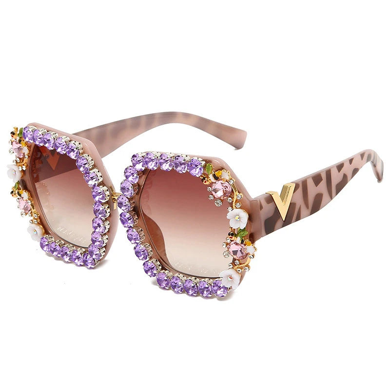 Decorative sunglasses with gemstones on a white background