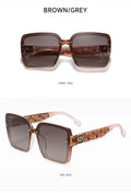 Sunglasses with brown and gray gradient lenses on a white background