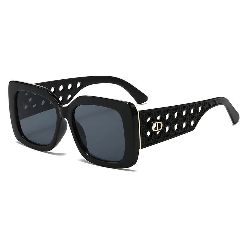 Black sunglasses with decorative frame on a white background