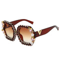 Decorative sunglasses with gemstones on a white background