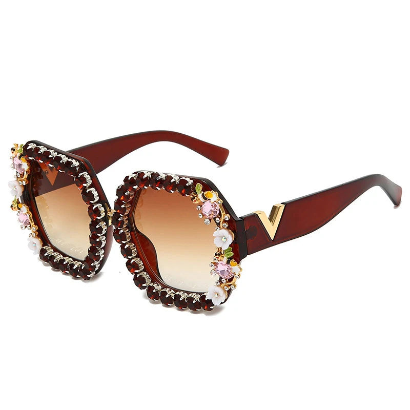Decorative sunglasses with gemstones on a white background