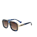 Sunglasses with blue and gold frame on a white surface with a black box in the background, featuring the brand 'DITAA'.