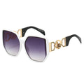 Sunglasses with gold and black frame on a white background