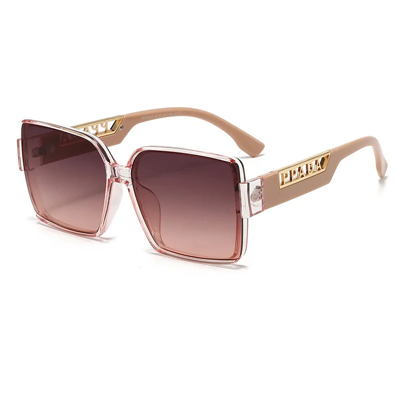 Sunglasses with gold frame and brown gradient lenses on a white background