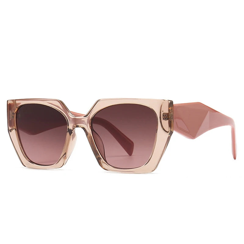 Sunglasses with a beige frame and brown gradient lenses on a white background