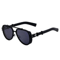 Black sunglasses with a unique frame design on a white background, branded 'seventpeople'.