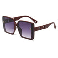Sunglasses with brown frame and gradient lenses on a white background
