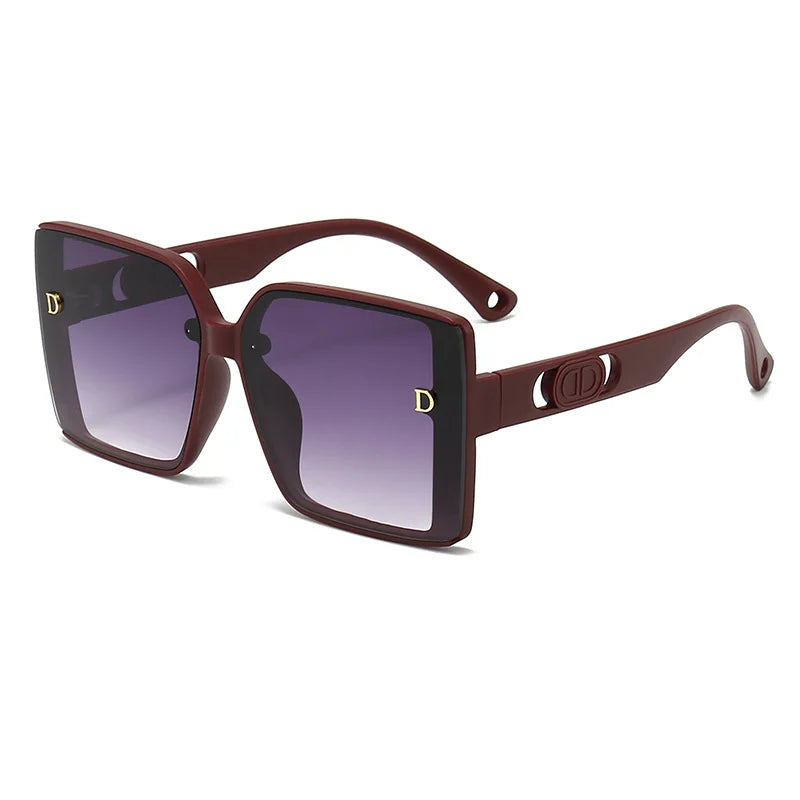 Sunglasses with brown frame and gradient lenses on a white background