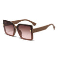 Brown sunglasses with gradient lenses on a white background