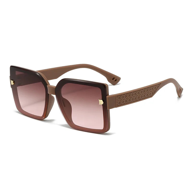 Brown sunglasses with gradient lenses on a white background