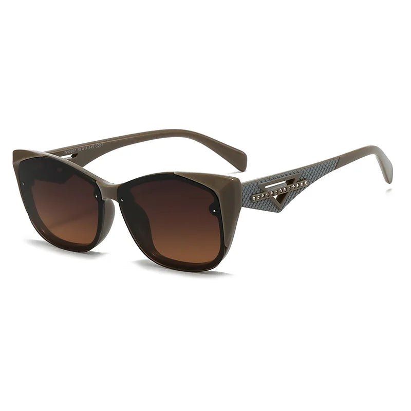 Sunglasses with brown gradient lenses and decorative arm on a white background