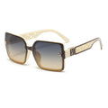 Sunglasses with decorative frame on a white background