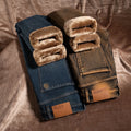 Folded jeans with brown shearling lining on a textured surface