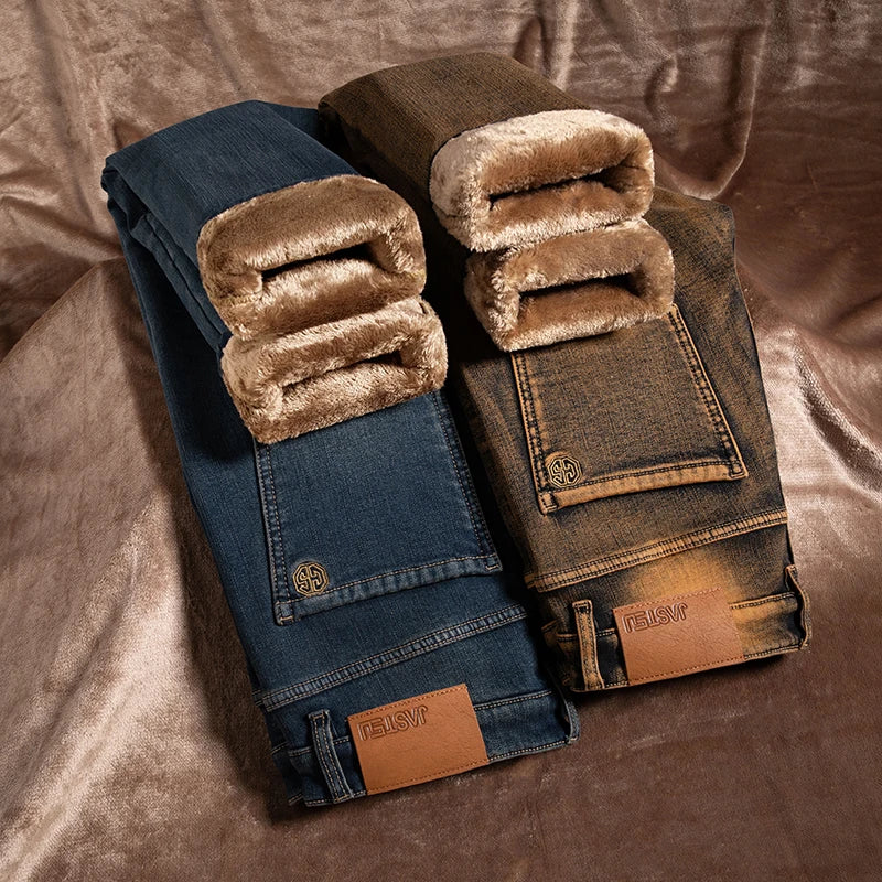 Folded jeans with brown shearling lining on a textured surface