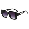 Black sunglasses with gradient lenses on a white background