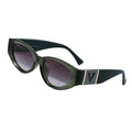 Green sunglasses with a brand logo on a light gray background