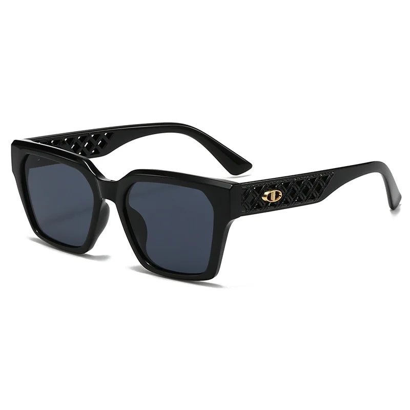Black sunglasses with intricate design on a white background