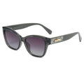 Gray sunglasses with a decorative arm on a white background