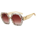 Sunglasses with gold frame and brown gradient lenses on a white background