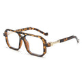 Tortoiseshell eyeglasses with gold accents on a white background