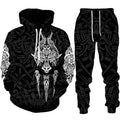 Black hoodie and pants set with intricate white designs on a white background