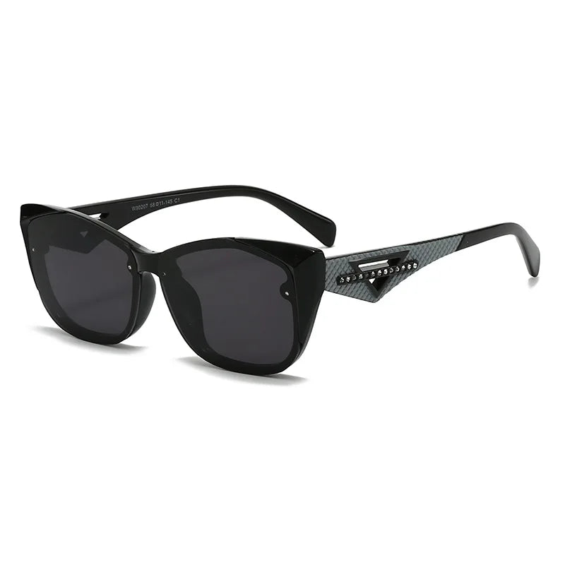 Black sunglasses with carbon fiber arm design on a white background