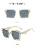 White gold and gray sunglasses with a clear background